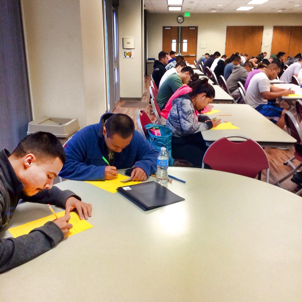 Participants sitting at tables working